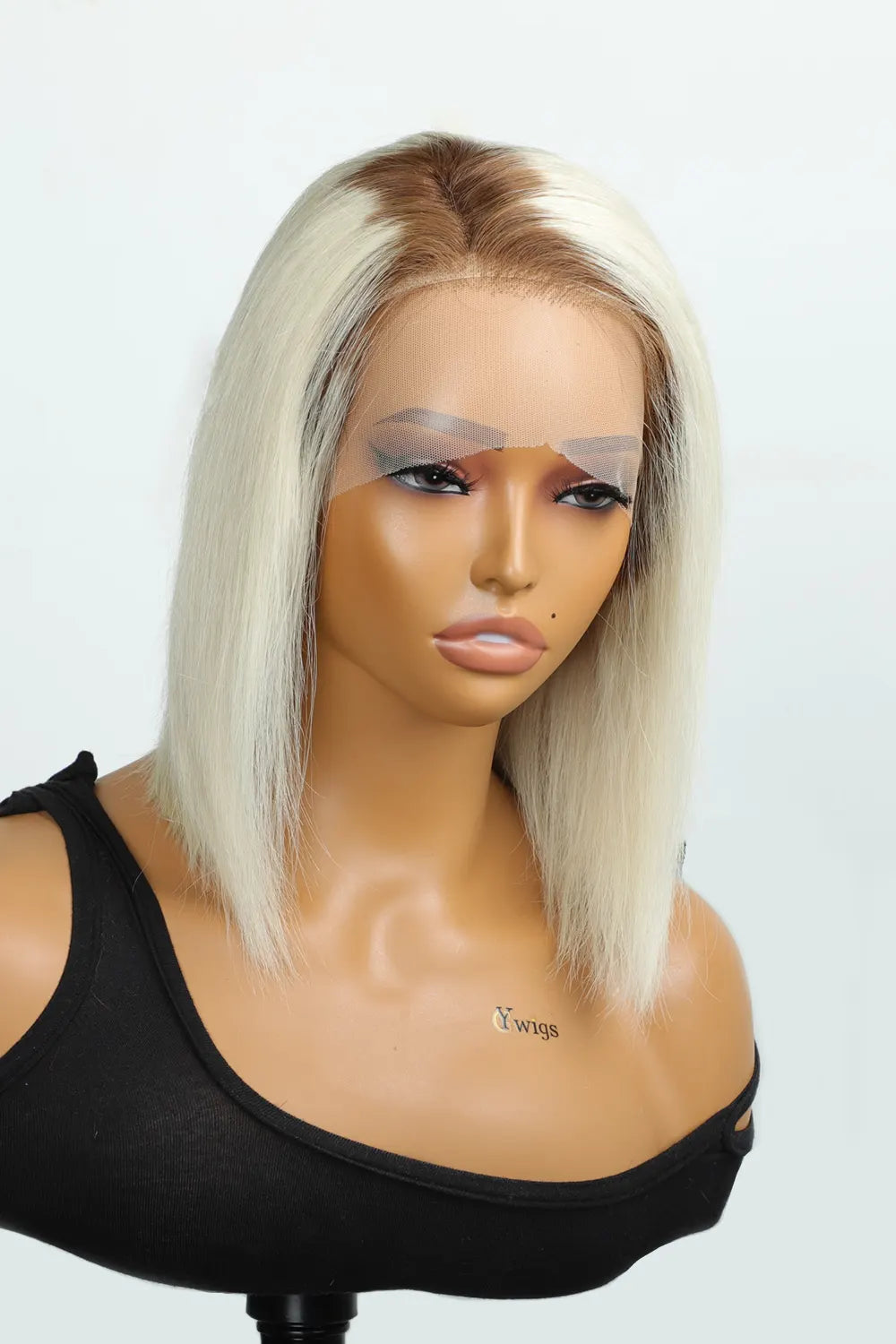 Front view of beautiful model with blond and brown roots hair