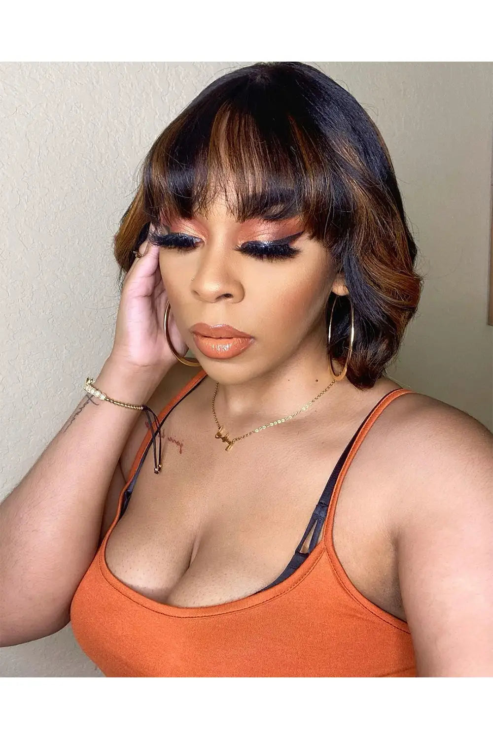 brown highlights medium bob with bangs beautiful model