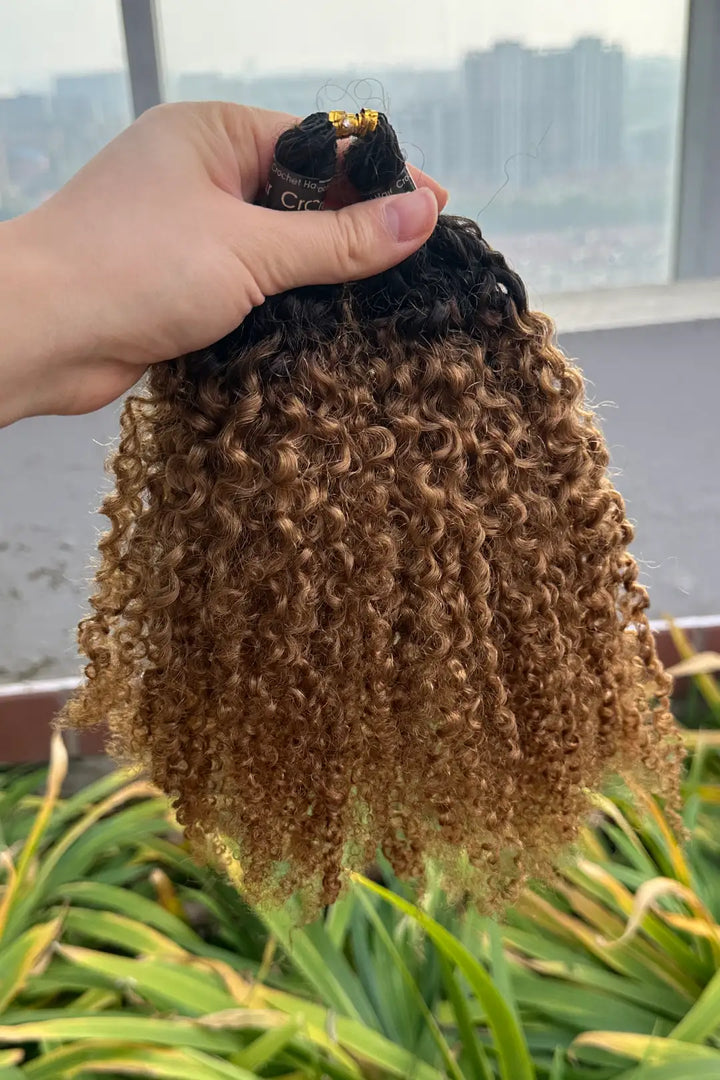 Outdoor picture of  1b/30 two tone color tight curly feather crochet human hair