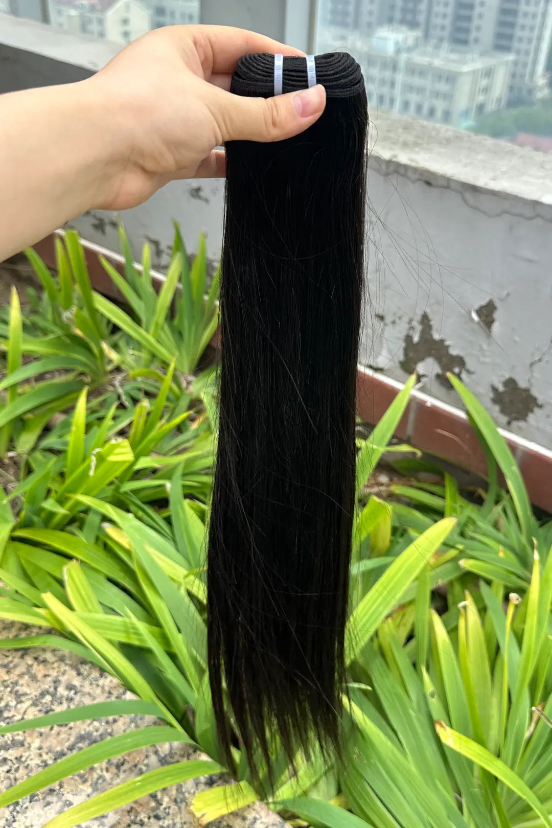 Outdoor picture of cambodia raw hair bundle straight natural color 12a