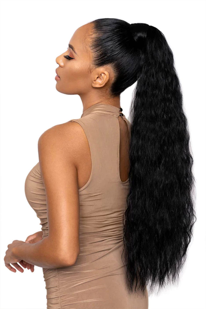 A woman with a high ponytail hairstyle using a hair extension to add length and volume, with a focus on the extended hair strip wrapped around the base.