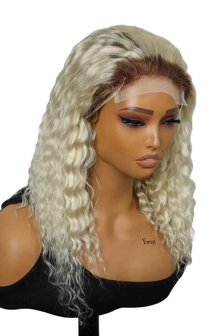 Side view of model with short blonde wavy hair