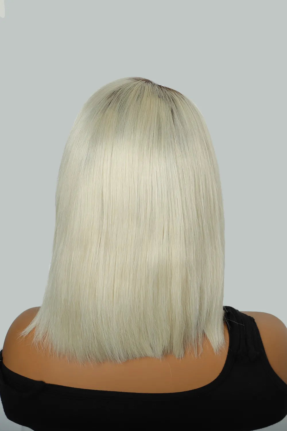 Rear view of model with short blonde hair