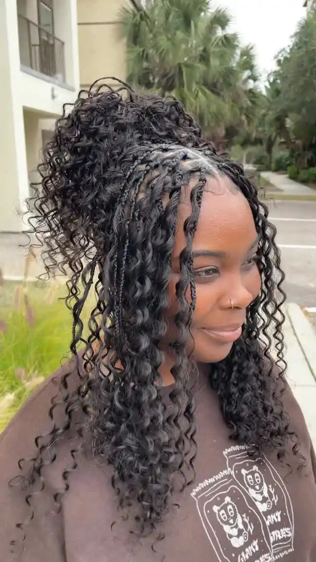 Person with styled hair outdoors on a street