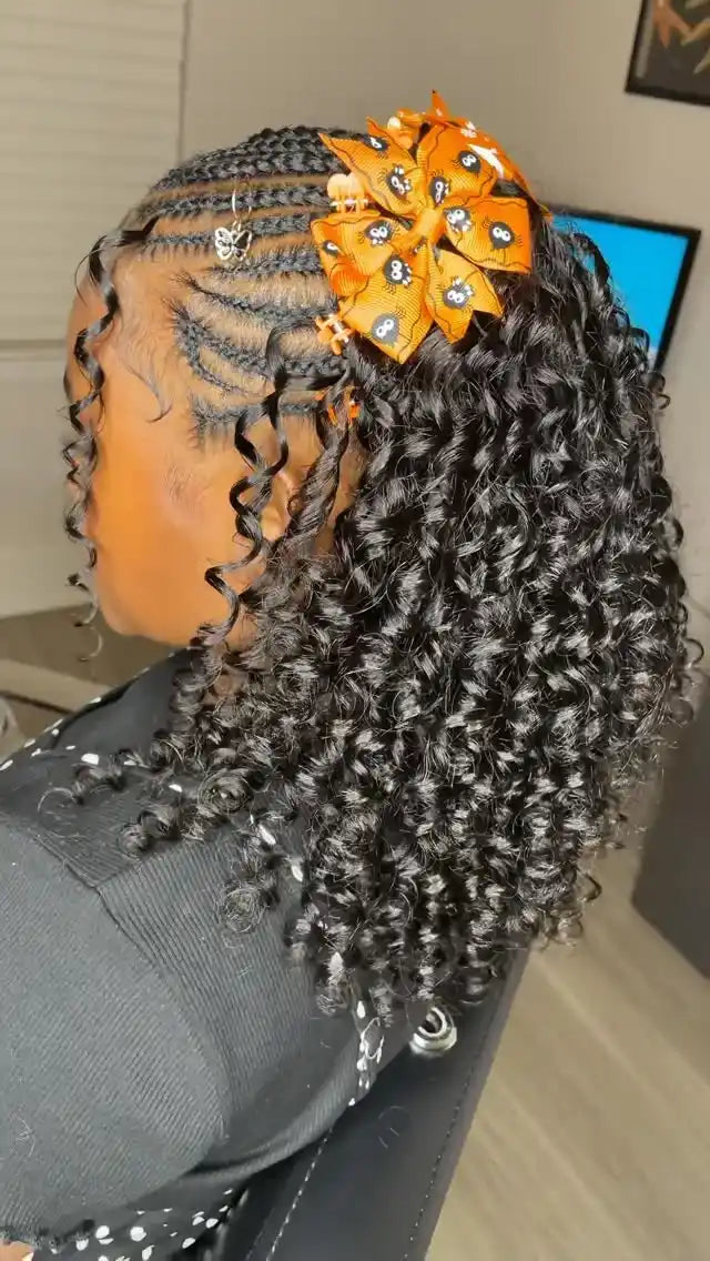 Person with styled hair wearing an orange headband with decorative elements.