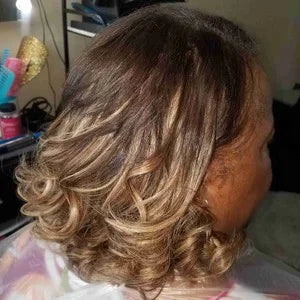 Person with styled hair in a salon setting