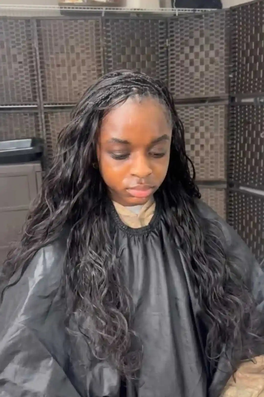 Person with styled hair in a salon setting