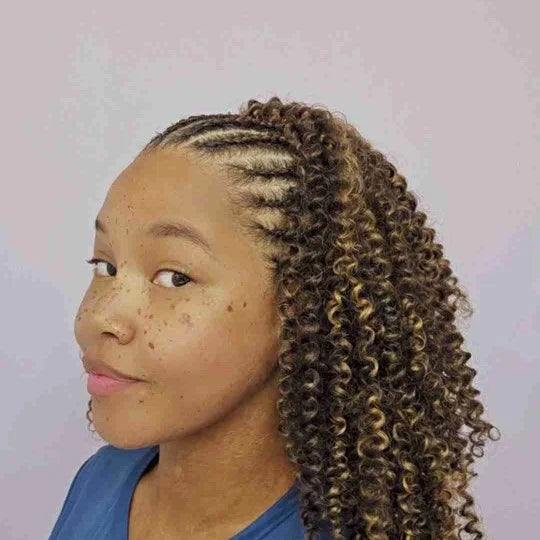 Person with styled hair against a plain background