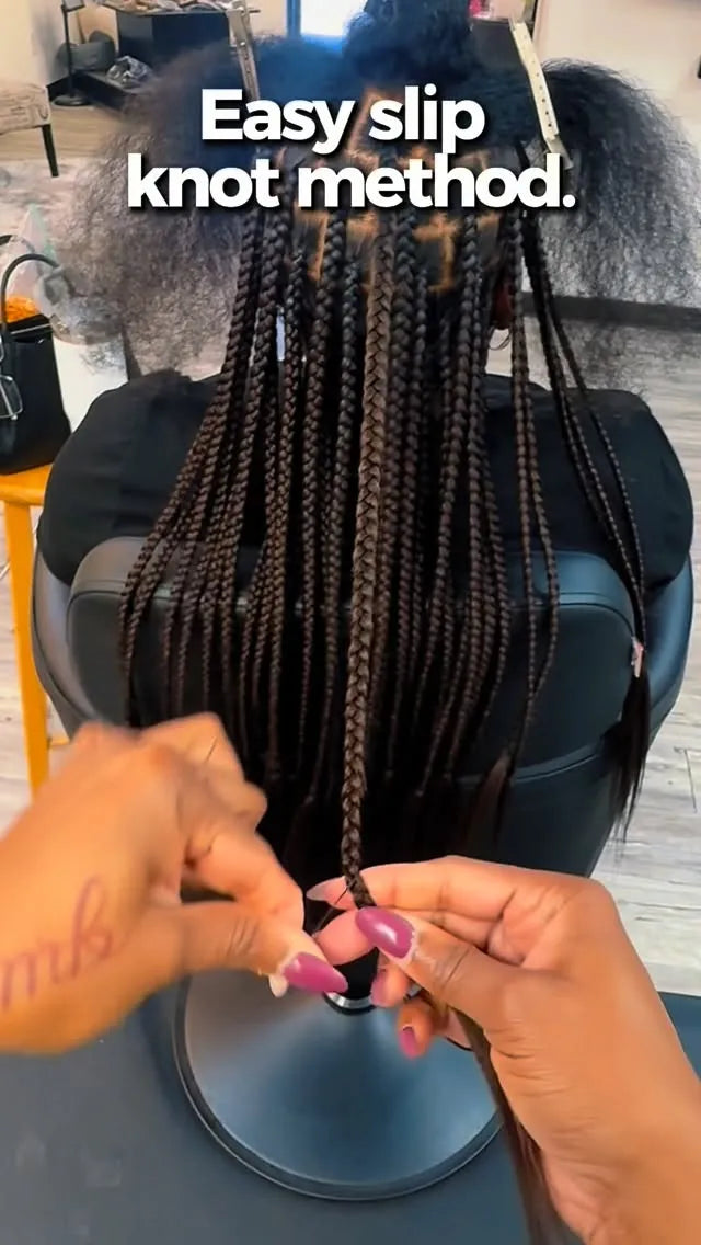 Person demonstrating the easy slip knot method for braiding hair in a salon setting.