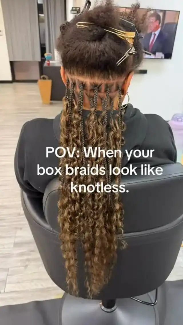 Person with long box braids sitting in a salon chair, text overlay 'POV: When your box braids look like knotless.'