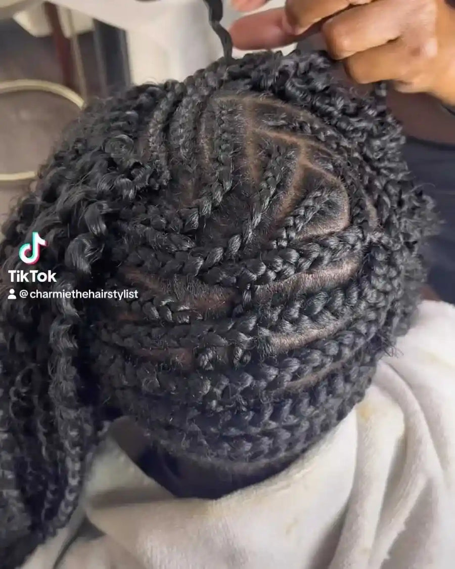 Close-up of braided hair with TikTok watermark and username.