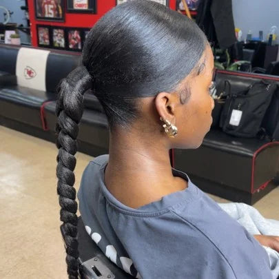 Woman with braided hair in a salon setting