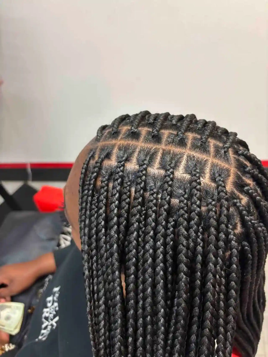 Close-up of braided hair with a blurred background