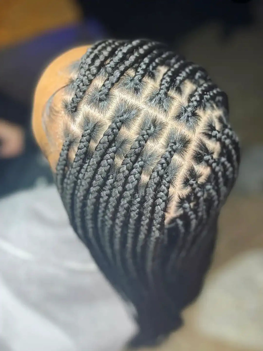 Close-up of braided hair with a blurred background