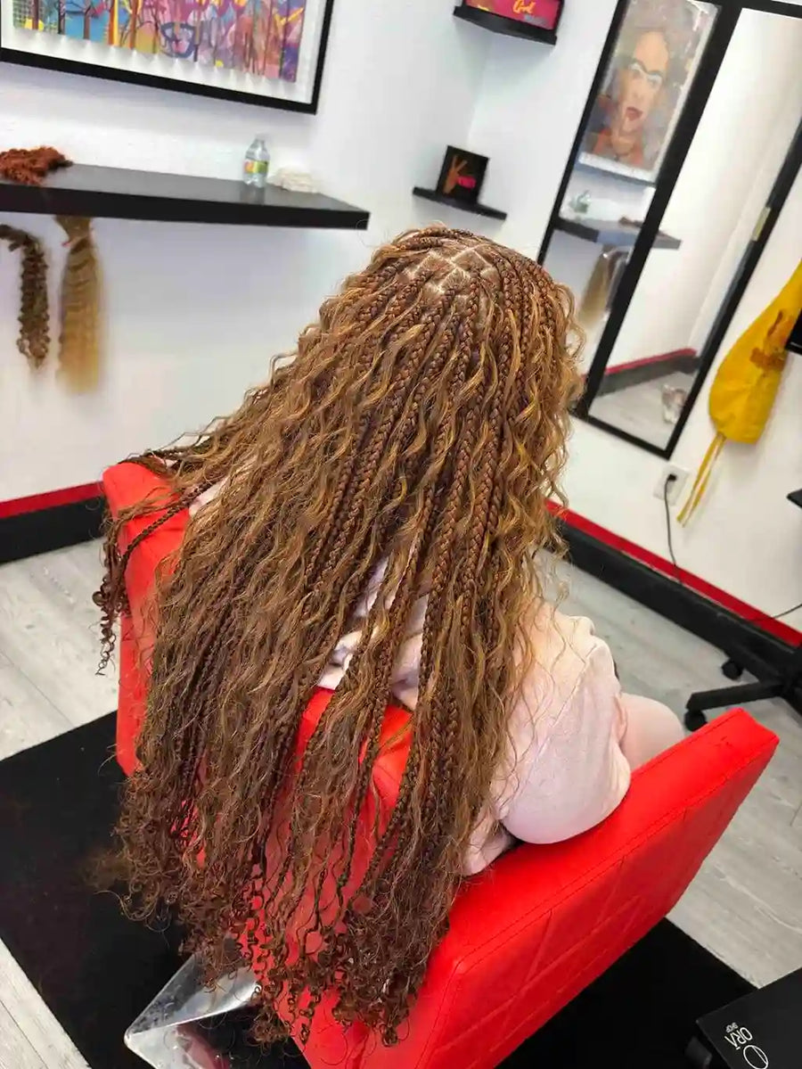 Mannequin head with long braided hair in a salon setting