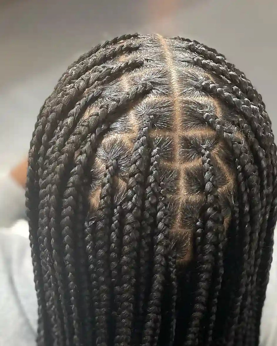 Close-up of braided hair with a blurred background