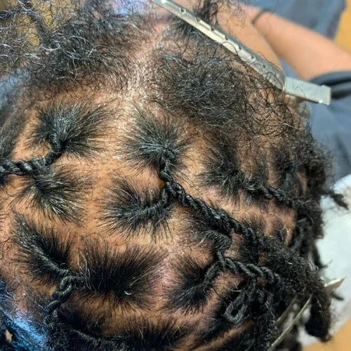 Close-up of braided hair with a measuring tool