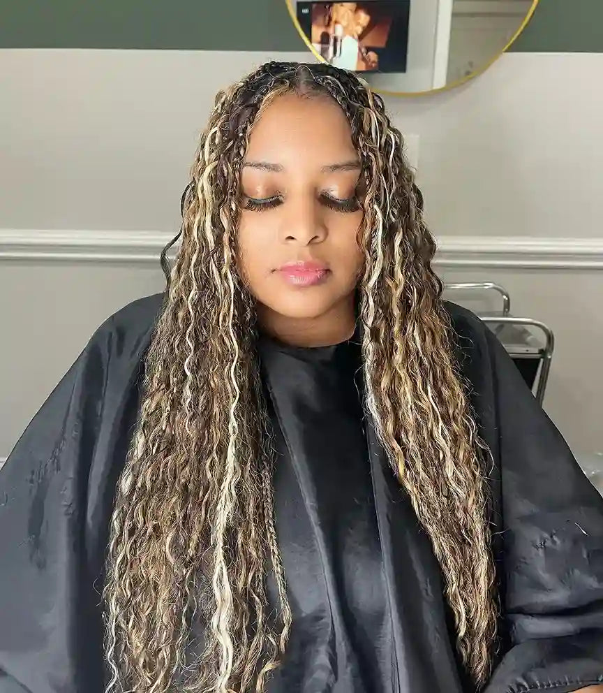 Woman with long, styled hair in a salon setting