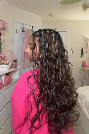 Ins influencer avawiththeflava shows the braiding process of dark brown body wave feather crochet hair extension for miracle knots