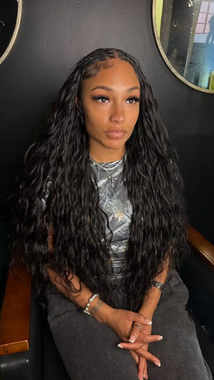 Ins influencer braidedbybrittt shows the braiding process of body wave feather crochet hair extension