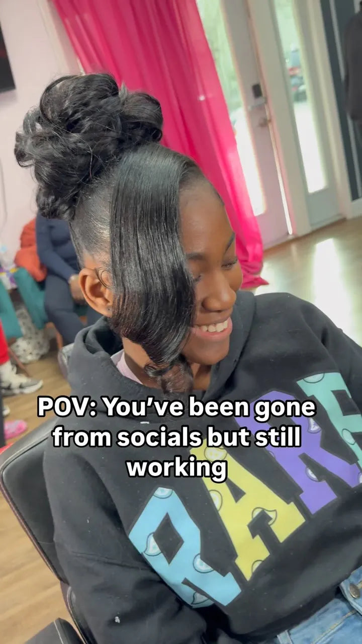 Sleek high bun hairstyle with side bang and soft curled pieces, hairstylist located in Augusta, GA