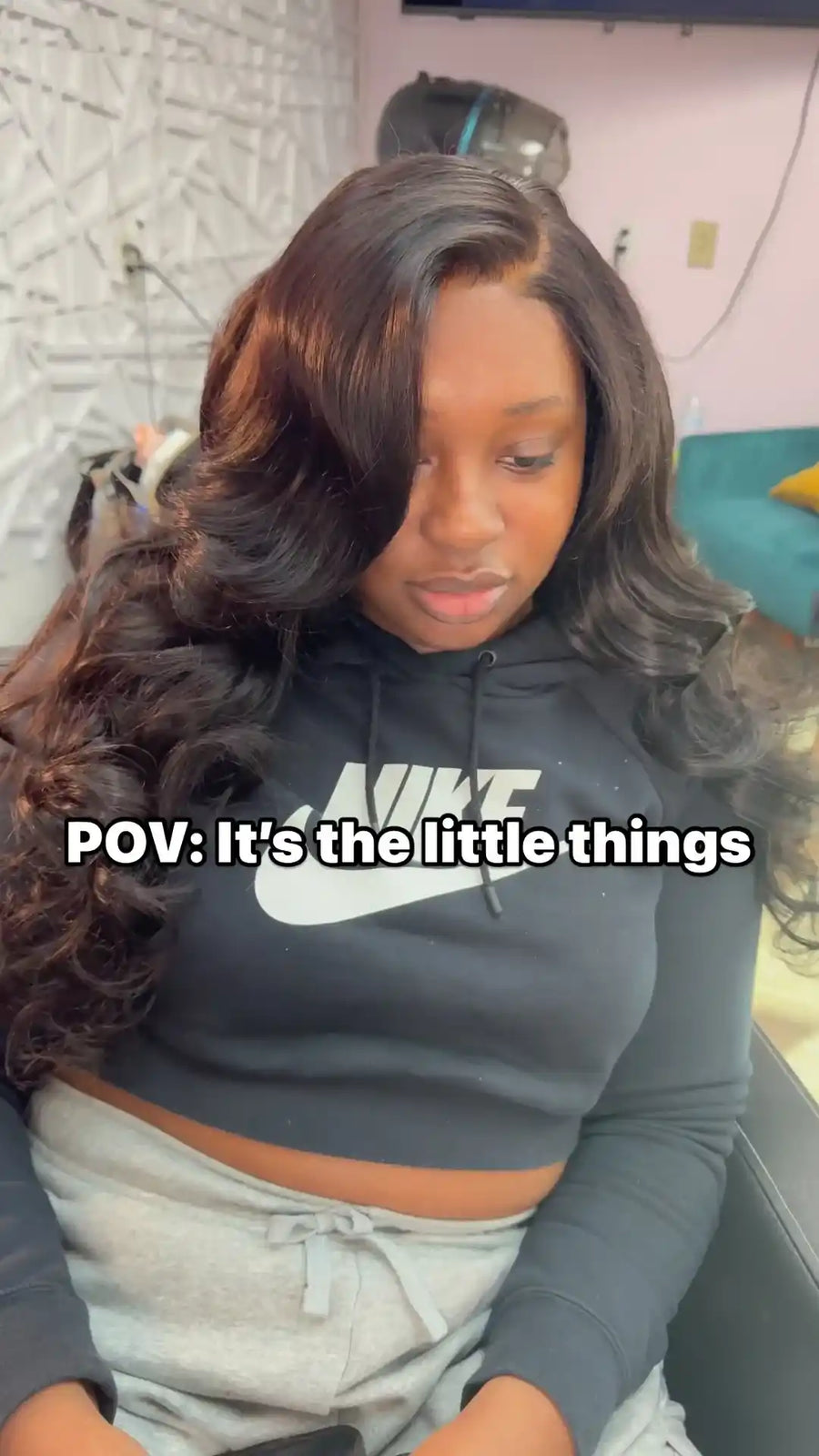 Long black body wave hairstyle with side part and voluminous soft curls, hairstylist located in Augusta, GA