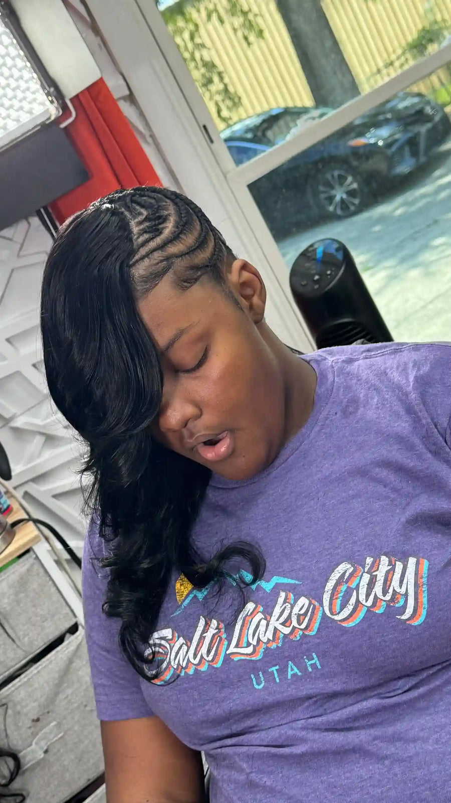 Side cornrow quick weave style with sleek swoop bang and long curls, hairstylist located in Augusta, GA