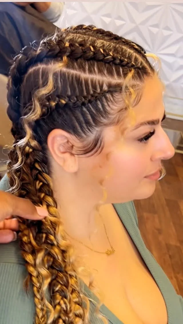 Woman with braided hair in a salon setting