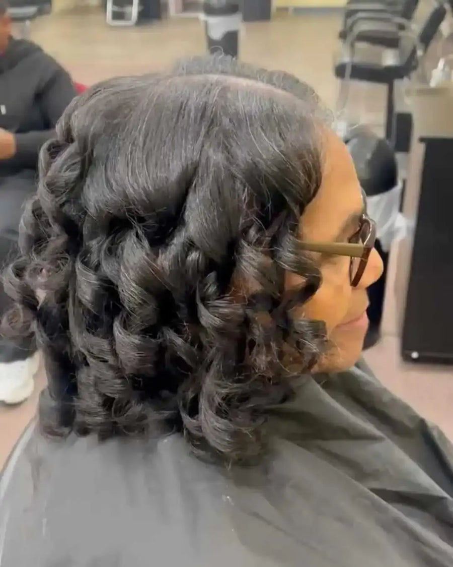 Person with styled hair in a salon setting