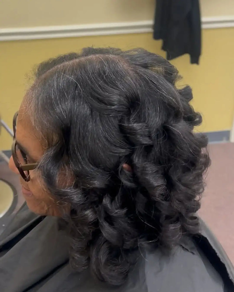 Person with styled hair in a salon setting