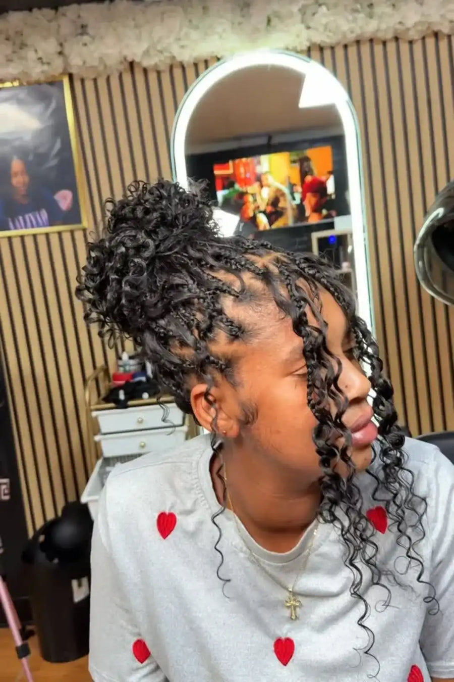 Person with styled hair in a salon setting