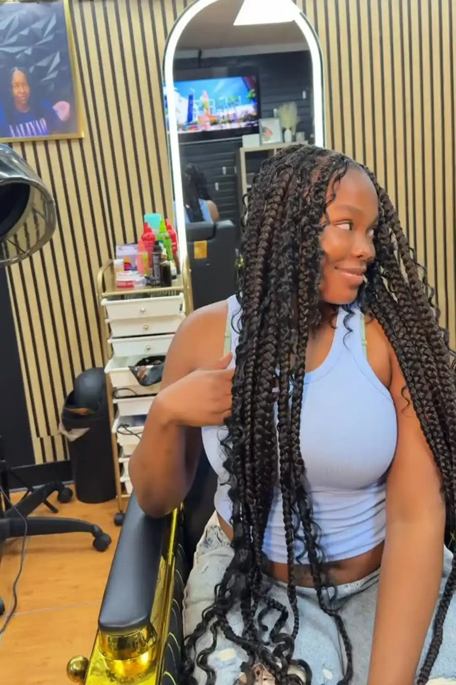Woman with braided hair in a salon setting