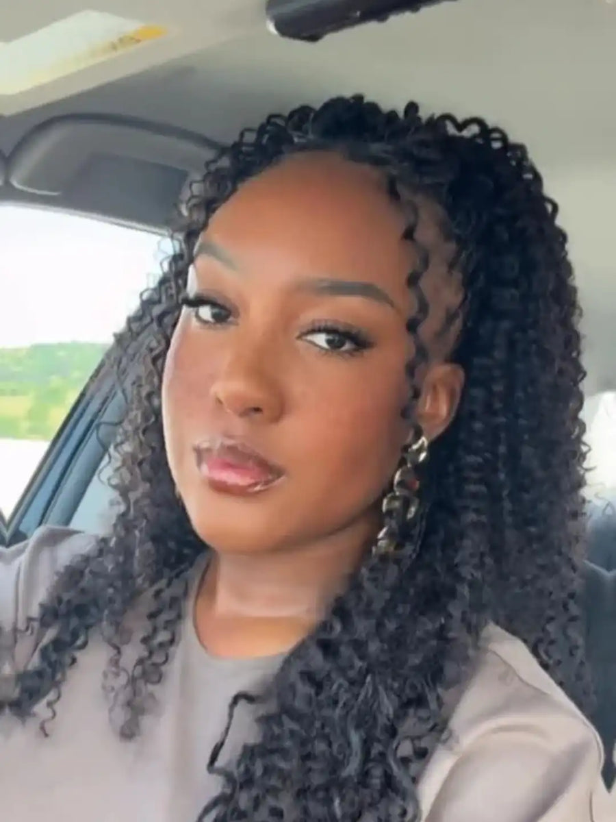 Woman with styled hair sitting inside a vehicle