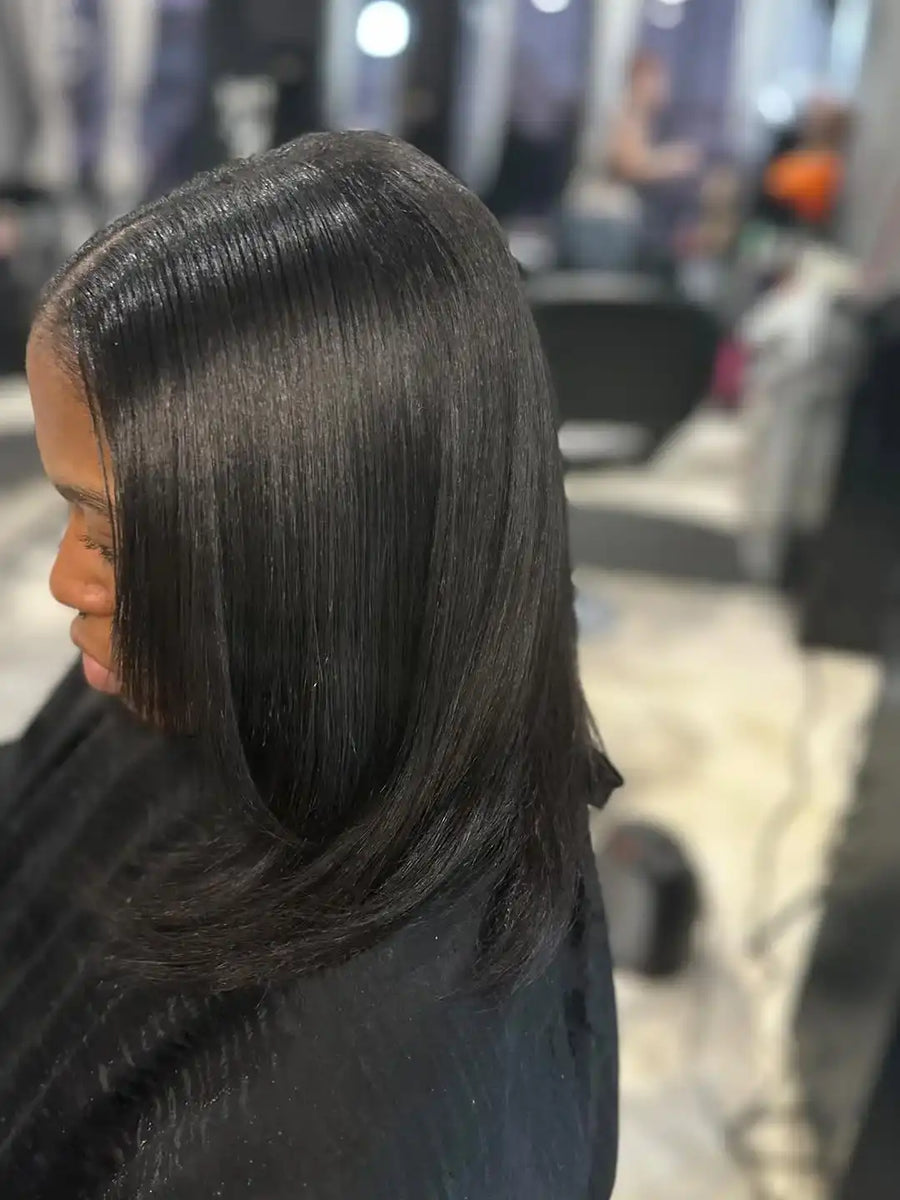 Person with styled hair in a salon setting