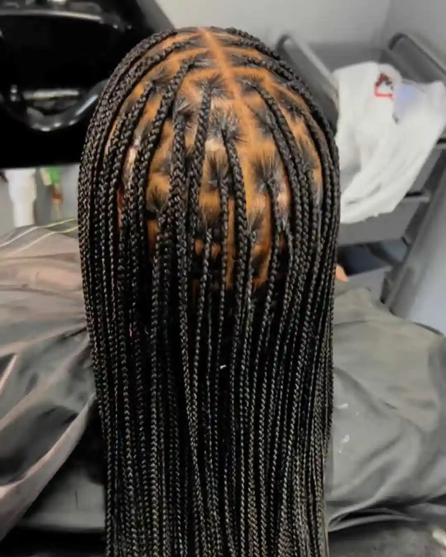 Close-up of braided hair with a blurred background