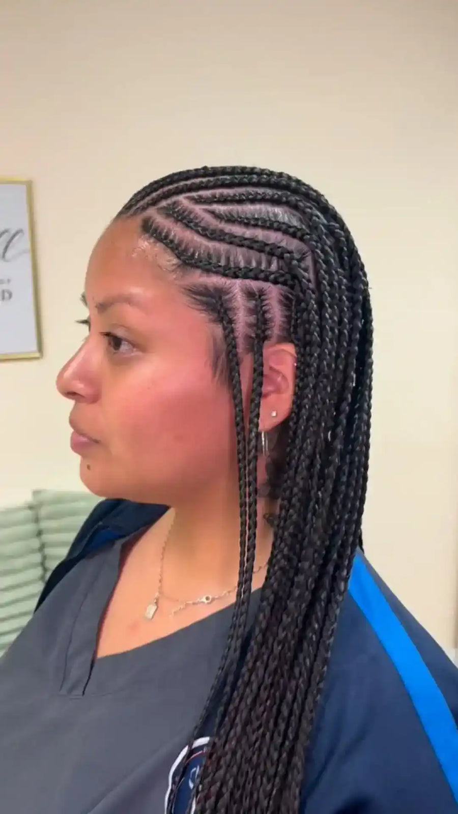 Woman with braided hair in a salon setting