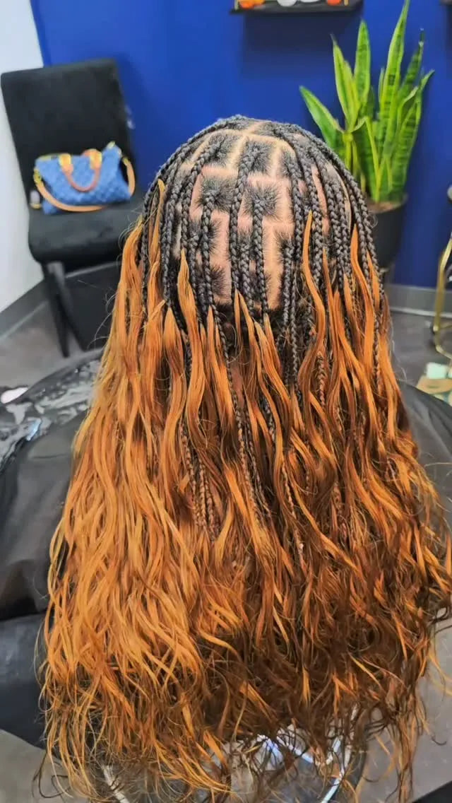 Ginger boho knotless braids with loose wavy ends, Stylist located in Atlanta, GA