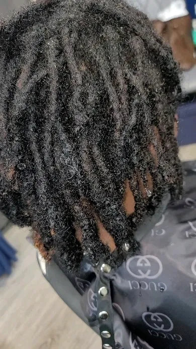 Short natural mini twists with coily texture, Stylist located in Atlanta, GA