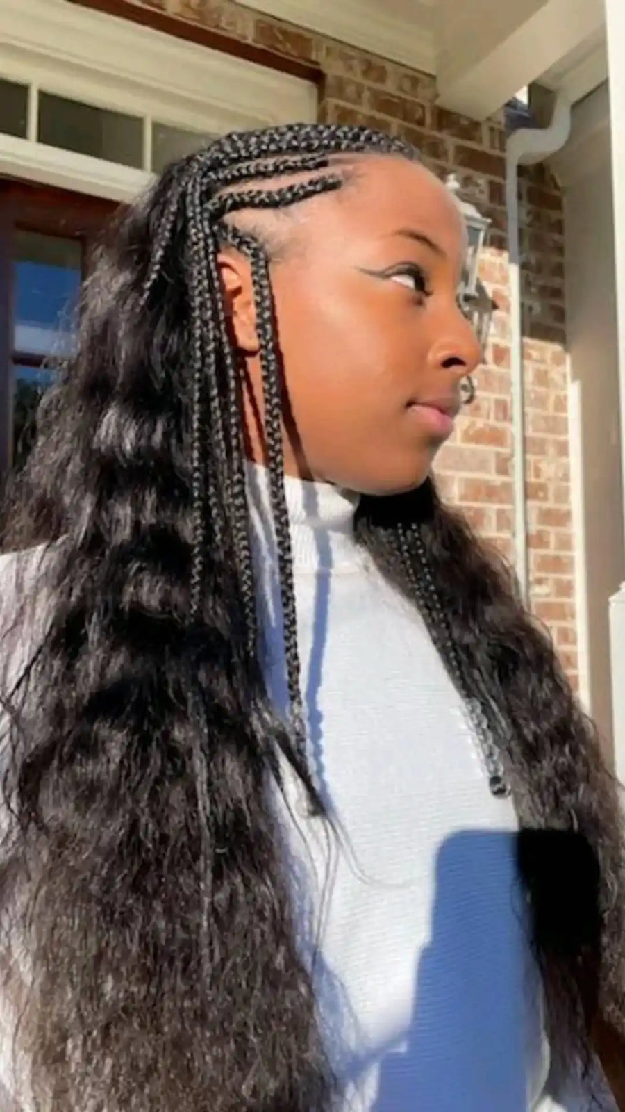 Side cornrow braids with long wavy hair extensions, Stylist located in Atlanta, GA