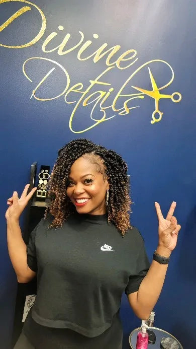 Shoulder-length curly crochet hairstyle with caramel highlights, Stylist located in Atlanta, GA