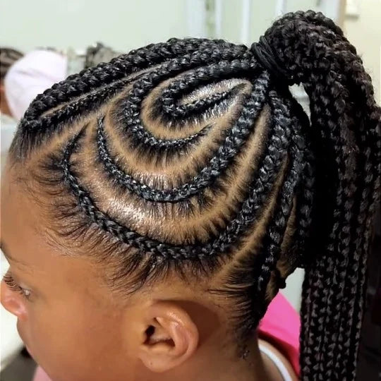Child with braided hair styled in a ponytail