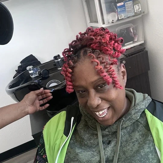 Person with styled hair in a salon setting
