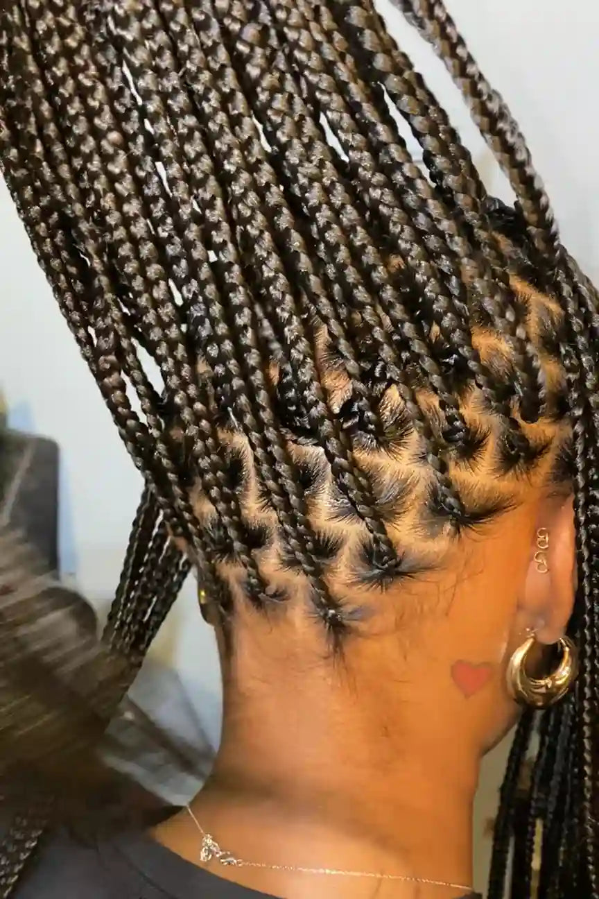 Close-up of braided hair with a neutral background