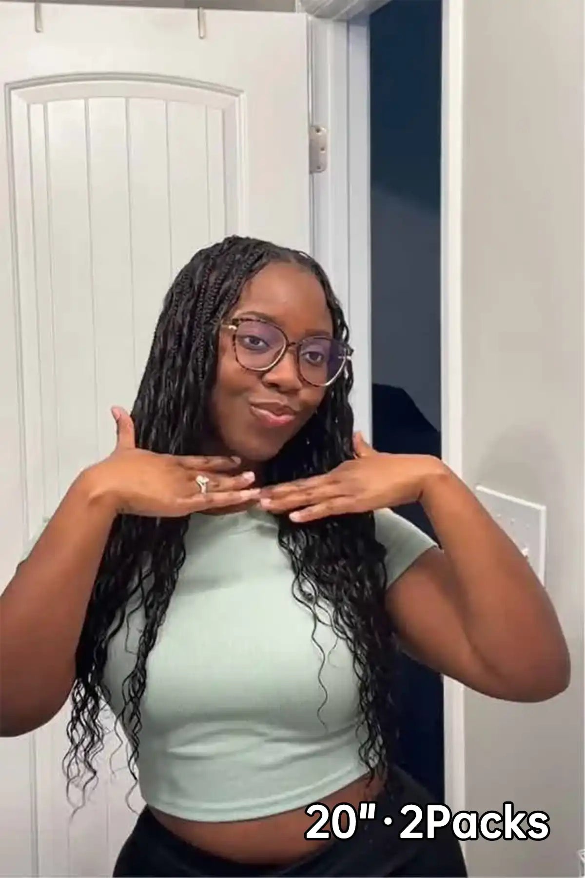 Tiktok influencer amber_699 shows the braiding process of loose deep wave feather crochet hair extension