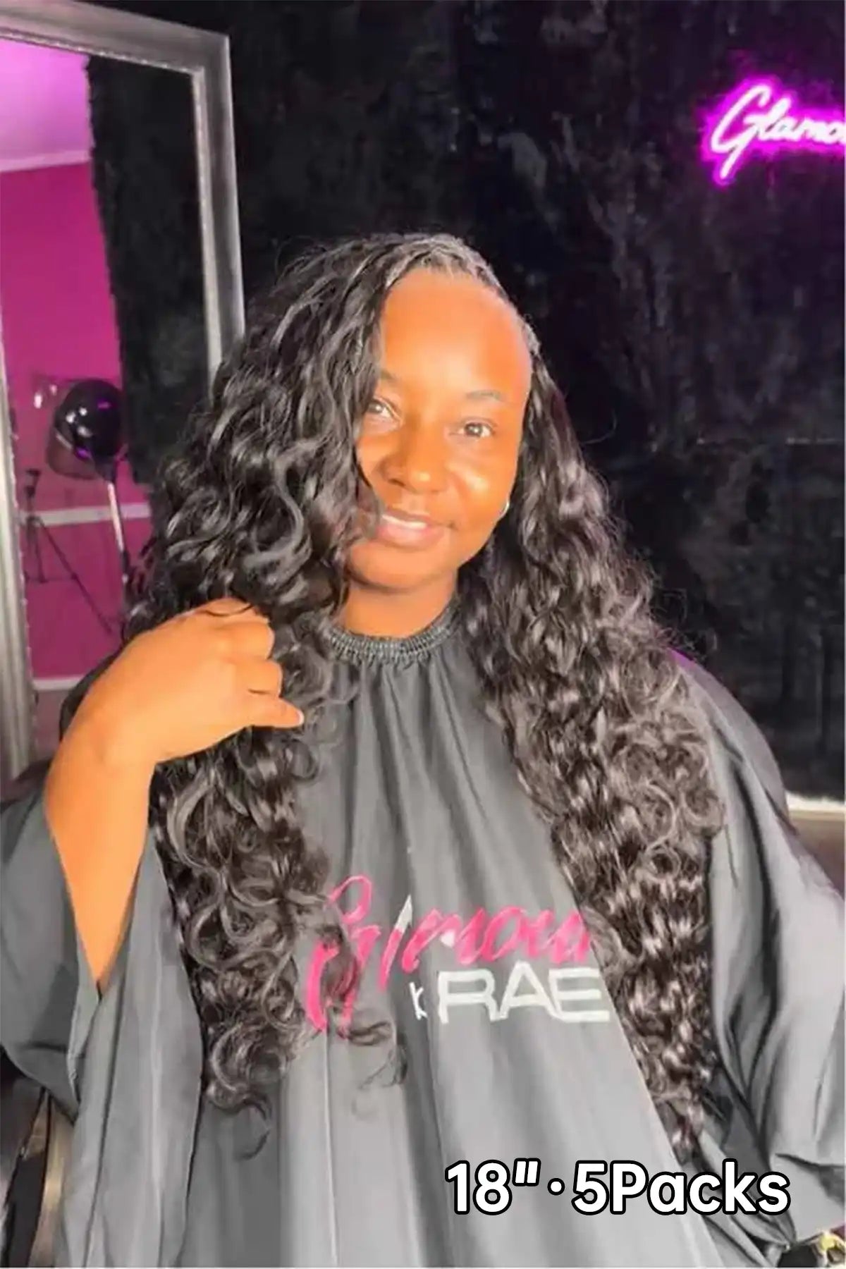 Tiktok influencer glamourbyrae shows the braiding process of body wave feather crochet hair extension