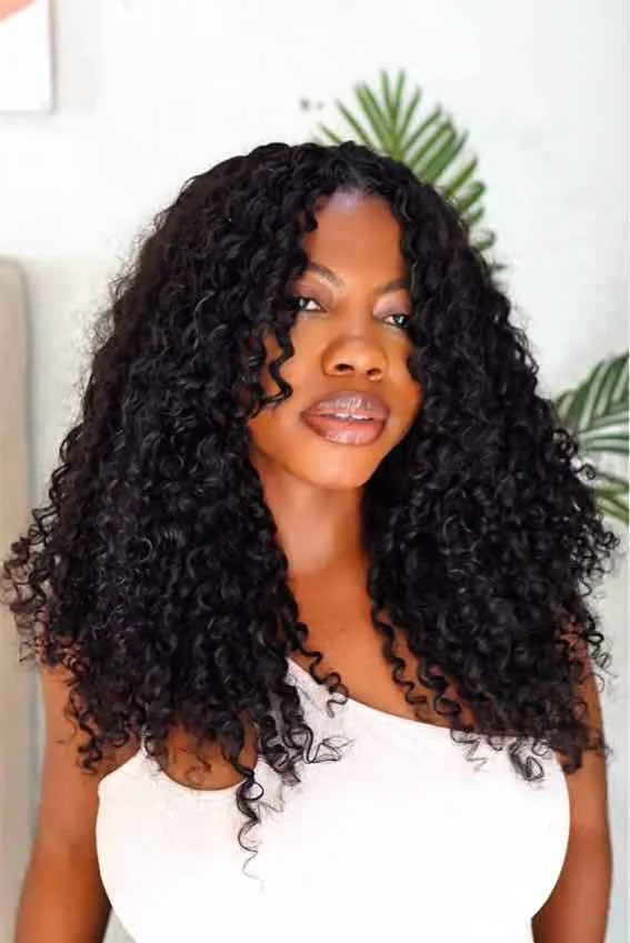 Tiktok influencer iam_ngozi  shows the braiding process of water wave feather crochet hair extension
