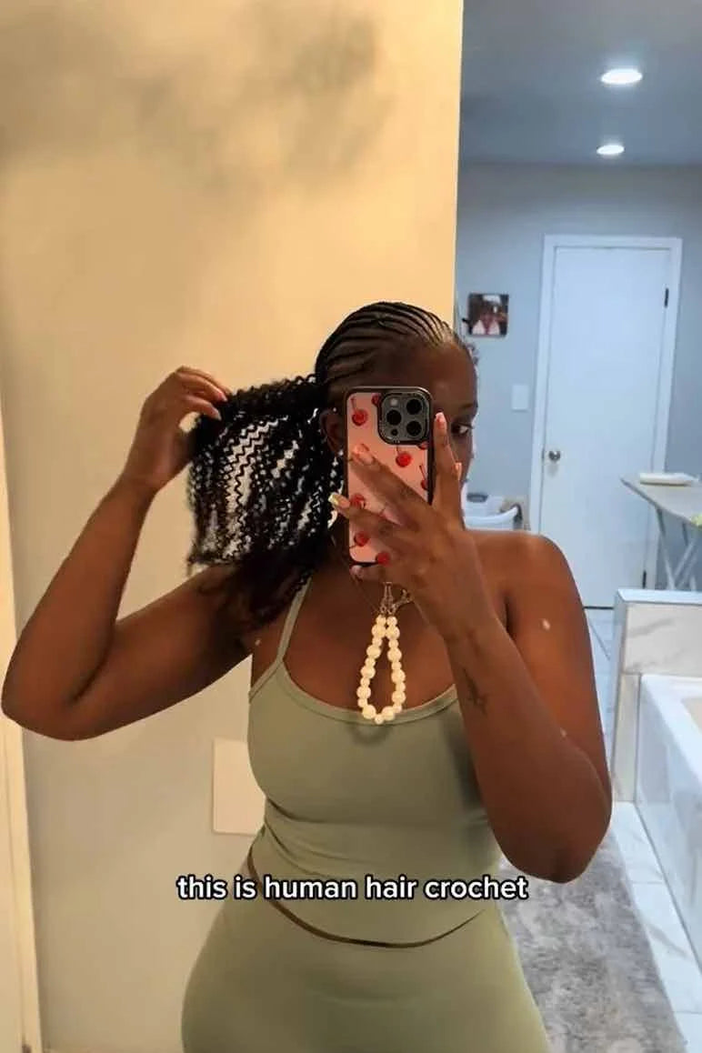 Tiktok influencer jadeenvermee shows the braiding process of afro kinky curly feather crochet hair extension