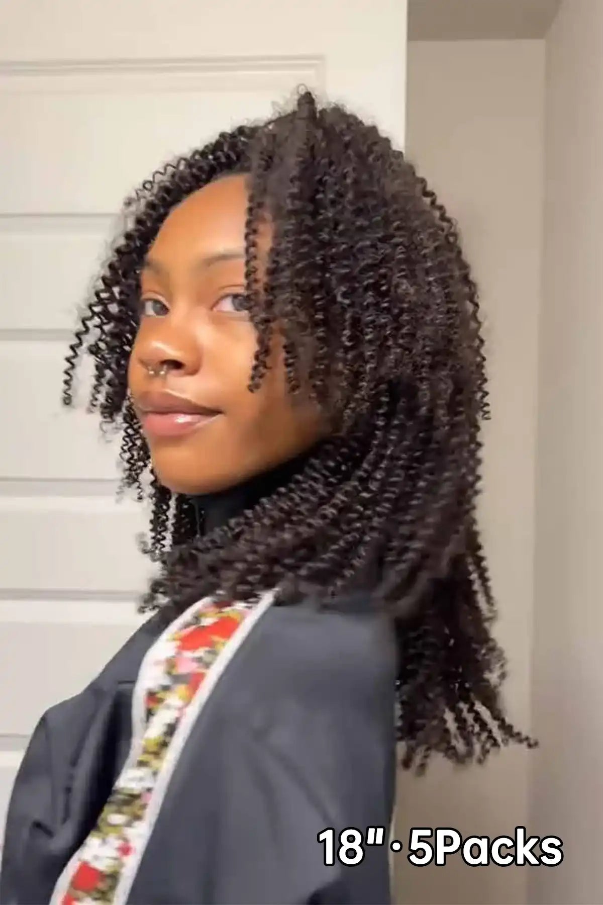 Tiktok influencer jairesemaj shows the braiding process of afro kinky curly feather crochet hair extension