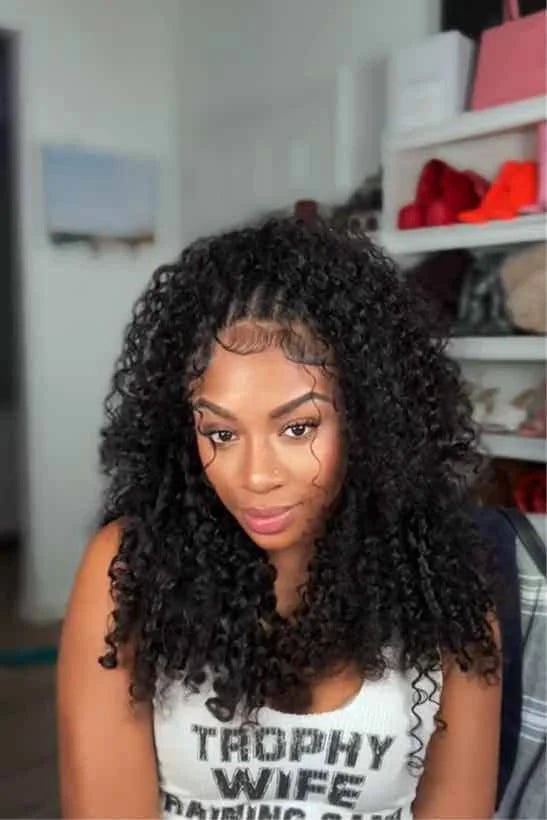 Tiktok influencer kaychelled shows the braiding process of burmese curly with spiral ends feather crochet hair extension