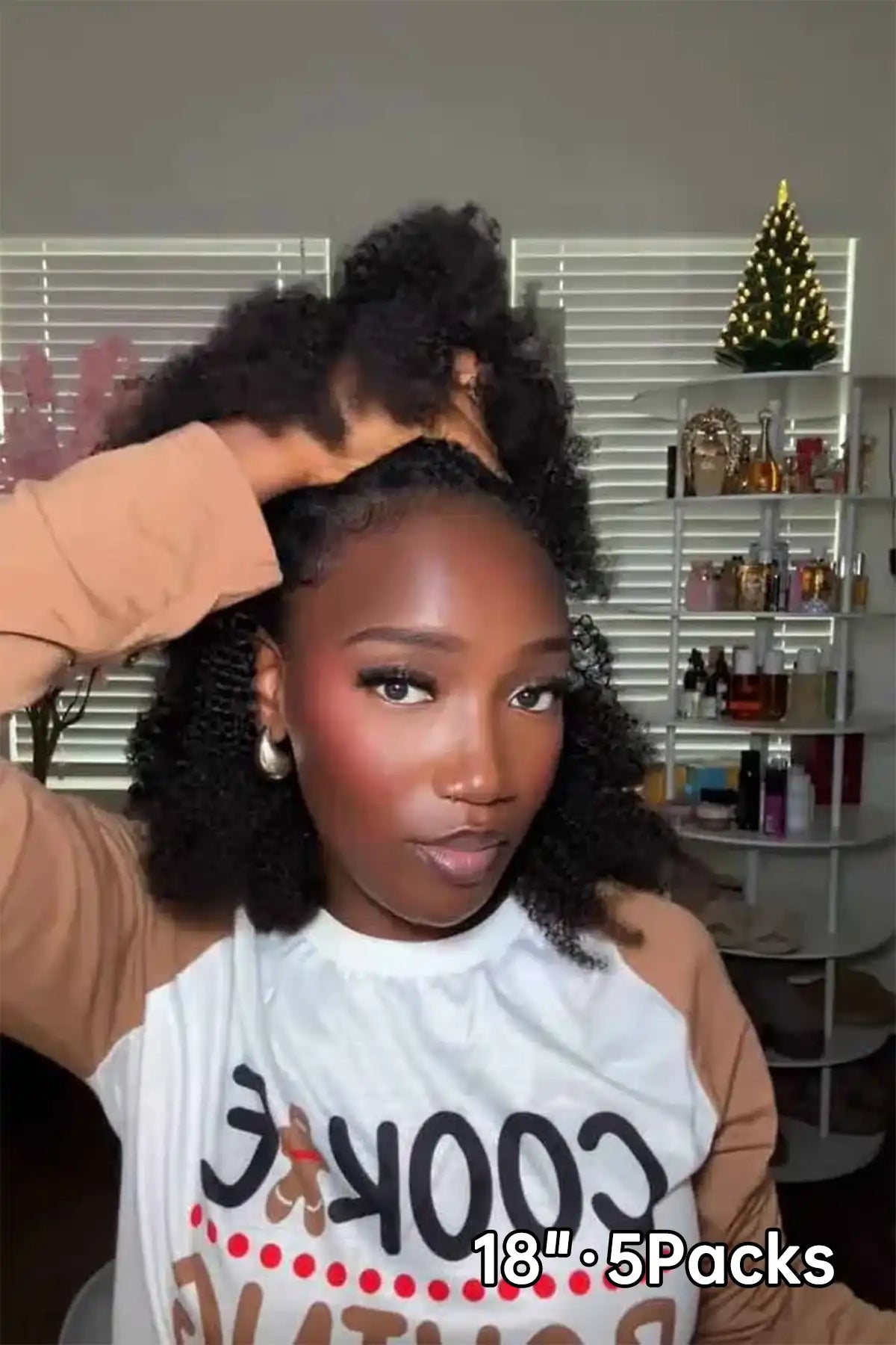 Tiktok influencer mimibelleofficiel shows the braiding process of afro kinky curly feather crochet hair 